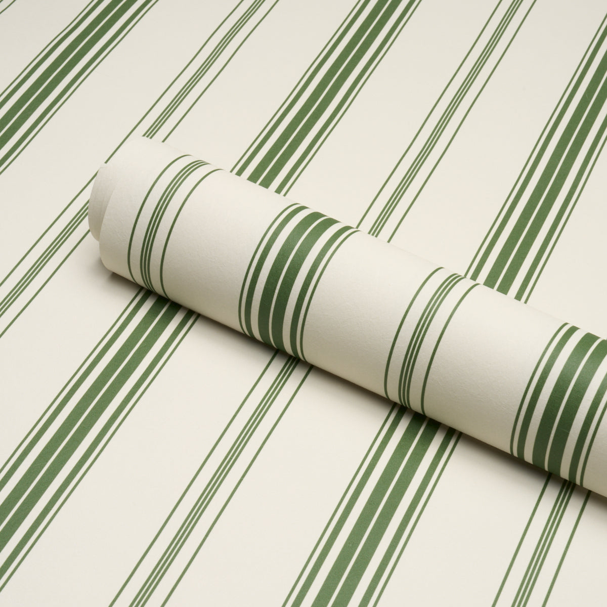 Coco Stripe Wallpaper in green color - pattern number 5018190 - by Schumacher in the Stripe Wallcovering Collection collection