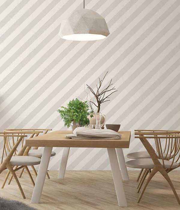 dining room with diagonal stripes on wall covering