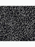 Laid Back Leopard Peel and Stick fabric in black color - pattern number 127462 - by Graham and Brown in the Peel and Stick Wallpaper by Nicole Miller collection